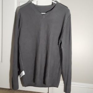 a grey sweater